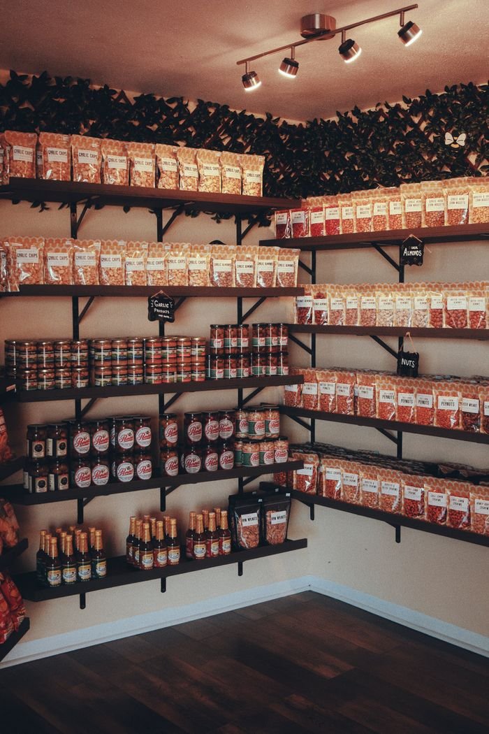 Services Neatly organized pantry showcasing various food items on shelves with warm lighting.